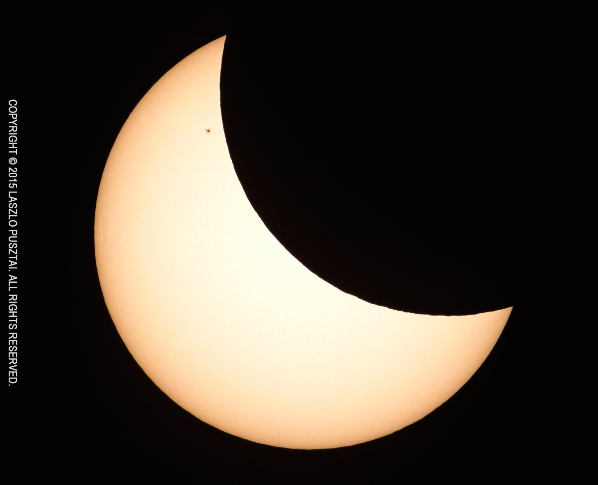 Partial Solar Eclipse with Sunspot 2303