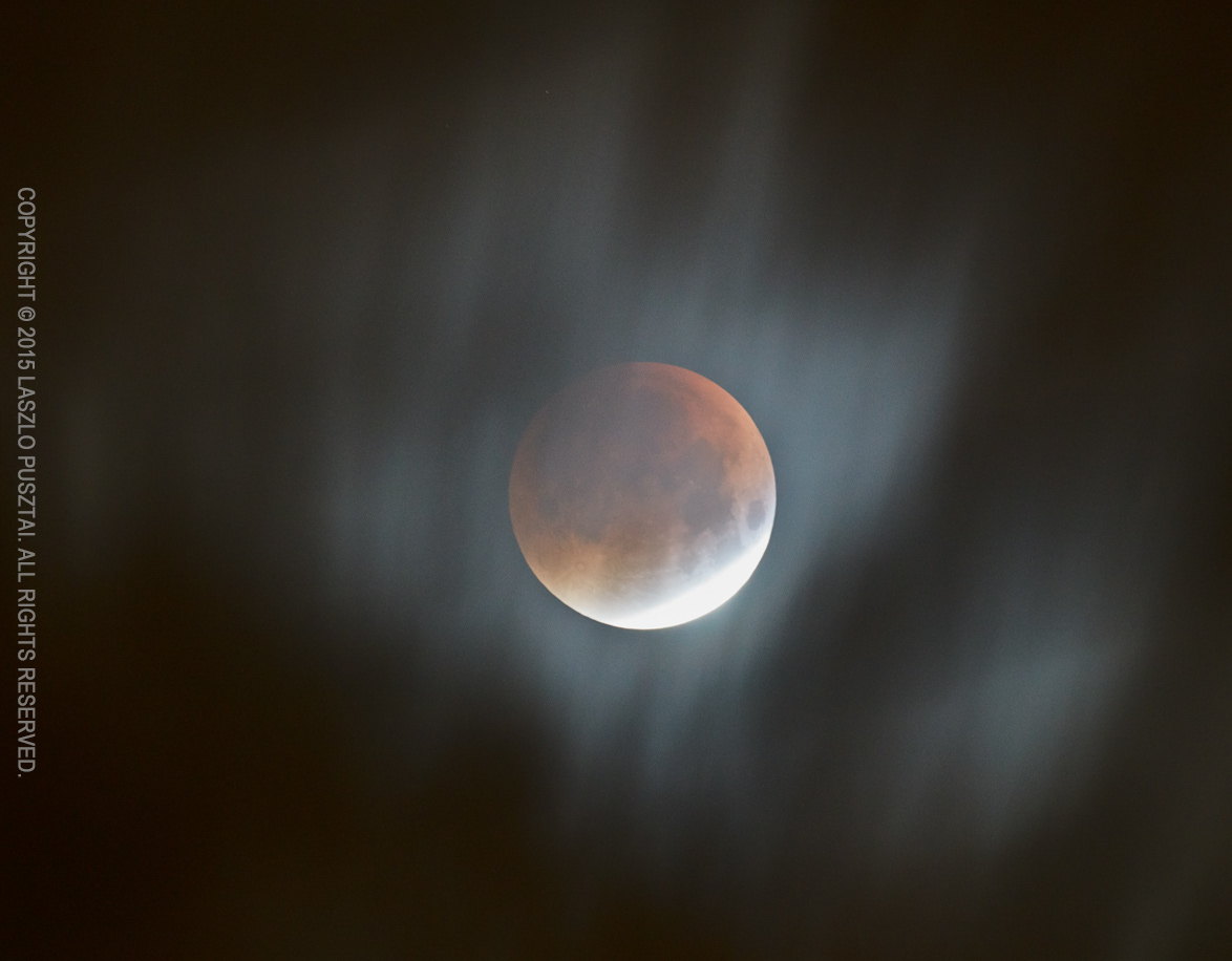 Eclipse Through the Clouds